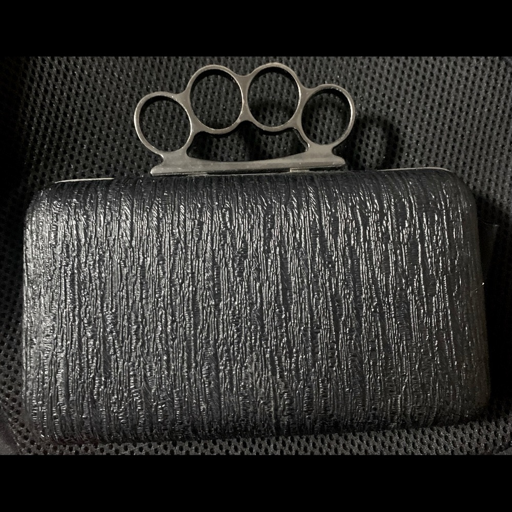 Authentic “Brass-knuckle” purse, black w/silver accents, has some scuffs